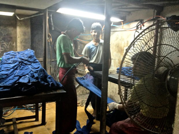 Bangladeshi garment workers spray jeans with potassium permanganate 