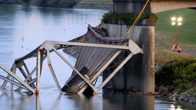 A collapsed portion of the Interstate 5 bridge lies in the Skagit River May 24, 2013, in Mount Vernon, Wash. 