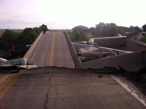 A massive train collision and derailment caused a highway overpass to collapse in Rockview, Mo., May 25, 2013. 