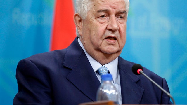 Syrian Foreign Minister Walid al-Moallem attends a press conference with his Iraqi counterpart, Hoshyar Zebari, not pictured, in Baghdad, Iraq, May 26, 2013. 