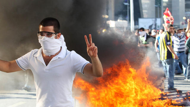 A protester flashes a victory sign as he takes part in a demonstration in support of protests in Istanbul and against the Turkish prime minister and his ruling Justice and Development Party in Ankara, Turkey, June 1, 2013. 