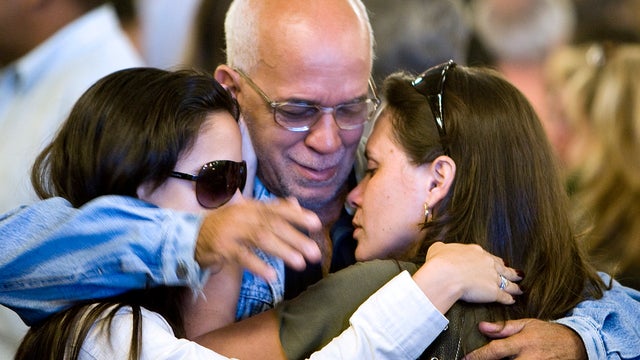 Friends and relatives of Air France Flight 447 passengers comfort each other after attending a Mass at the Candelaria Cathedral June 4, 2009, in Rio de Janeiro. 