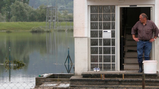 A man looks out of a house on June 10, 2013, after a week of heavy rains caused extensive damage in central and southern Germany. 