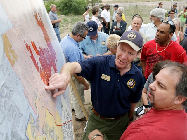 Incident Commander Rich Harvey, center, gives an update on the Black Forest Fire, to residents during a press briefing in Colorado Springs, Colo., on June 14, 2013. 