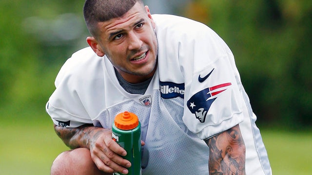 In December 2012 file photo, New England Patriots tight end Aaron Hernandez reacts during the second quarter of an NFL football game against the Houston Texans in Foxborough, Mass. State and local police spent hours at the home of New England Patriots tig 