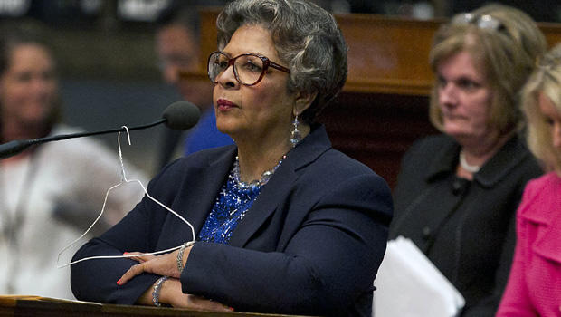 Rep. Senfronia Thompson, D-Houston, stands at the podium where she has hung a hanger from the microphone on the House floor as she attempts to add an amendment to create an exception for victims of rape and incest in Senate Bill 5 during debate at the State Capitol in Austin, Texas, on Sunday, June 23, 2013. 