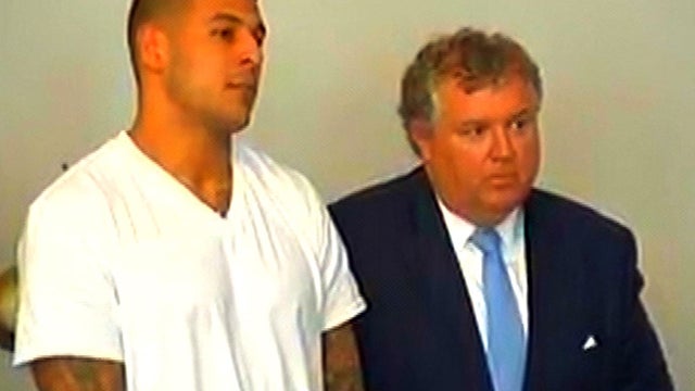 New England Patriots tight end Aaron Hernandez and his attorney, Michael Fee, appear in Attleboro District Court in Attleboro, Mass., June 26, 2013. 