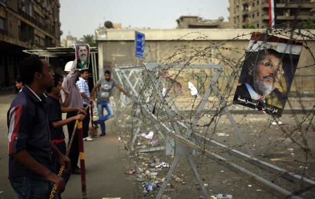 Supporters of ousted President Mohammed Morsi protest at the Republican Guard building in Nasr City, Cairo, Egypt, July 9, 2013. 