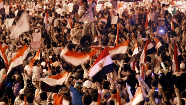 Supporters of Egypt's ousted President Mohammed Morsi block Giza square during march near Cairo University, in Giza, Cairo, Egypt, late Monday, July 15, 2013 