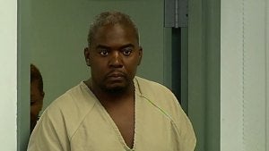 New England Patriots tight end Aaron Hernandez, left, stands with his attorney, Michael Fee, right, during a hearing in Attleboro District Court June 26, 2013, in Attleboro, Mass. 