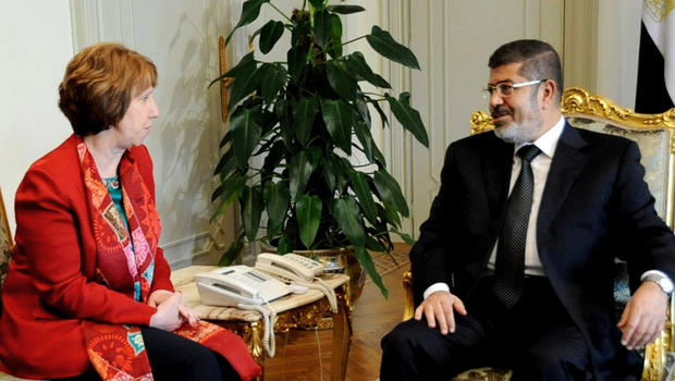 In this Wednesday, June 19, 2013 file image released by the Egyptian Presidency, Egyptian President Mohammed Morsi, right, meets with High Representative of the European Union for Foreign Affairs Catherine Ashton, at the Presidential Palace in Cairo, Egypt. Ashton held a two-hour meeting with Morsi, the EU said on Tuesday, July 29, 2013, in the Islamist leader's first meeting with an outsider since the military deposed him nearly a month ago. 