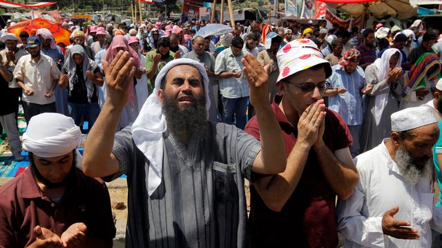 Supporters of Egypt's ousted President Mohammed Morsi attend Friday prayers at a camp near Cairo University in Giza, Egypt, southwest of Cairo, Aug. 2, 2013. 