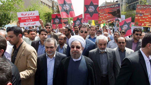 Iranian president-elect Hasan Rouhani, center 
