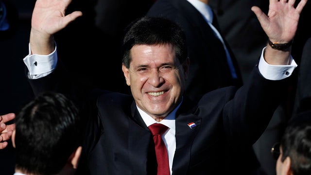 Paraguay's new President Horacio Cartes arrives for his swearing-in ceremony 