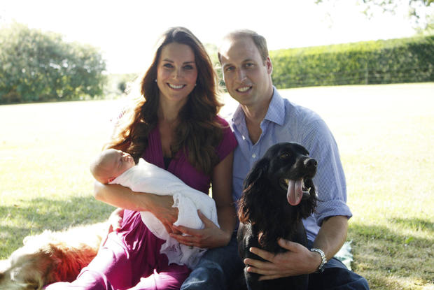 The Duke and Duchess of Cambridge and Prince George are pictured in early August in the Middleton's garden with a retriever called Tilly (a Middleton family pet), and with Lupo, the couple 