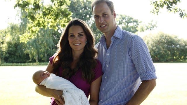 The Duke and Duchess of Cambridge and Prince George pose in early August in the garden of the Middleton family home in Bucklebury, England. 