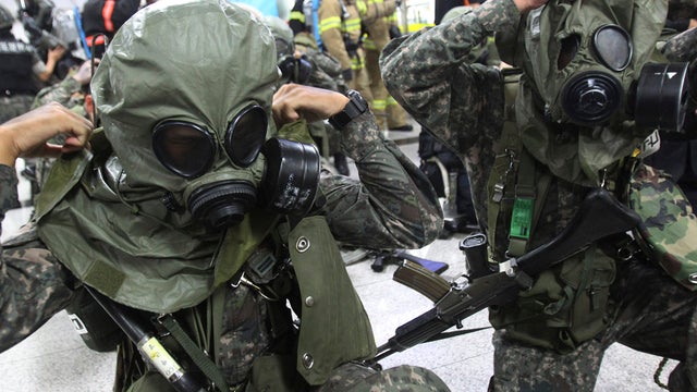 South Korean army soldiers put on gas masks during South Korea-U.S. joint military exercise, "Ulchi Focus Lens"  
