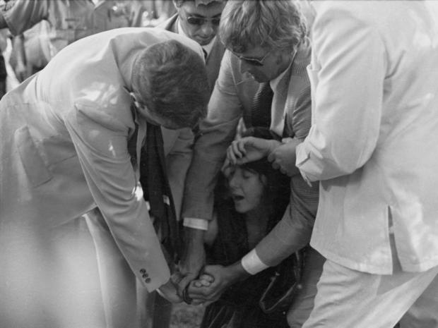 Sept. 5, 1975 file photo shows U.S. Secret Service agents putting handcuffs on Lynette "Squeaky" Fromme after she pointed gun at President Gerald Ford, in Sacramento, Calif. 