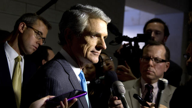 Republican Rep. Scott Rigell, R-Va., talks with media before entering a classified members-only briefing on Syria on Capitol Hill in Washington Sunday, Sept. 1, 2013.  