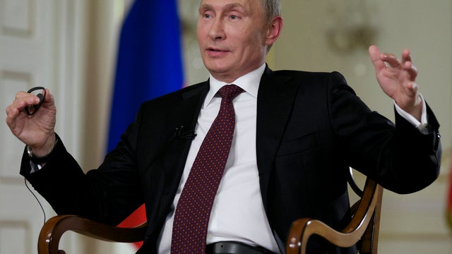 Russian President Vladimir Putin gestures during an AP interview at Putin's Novo-Ogaryovo residence outside Moscow, Russia, Tuesday, Sept. 3, 2013 