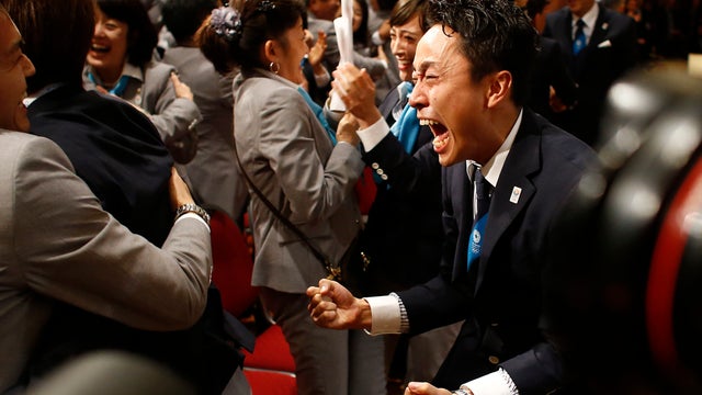 Members of the Tokyo 2020 delegation celebrate after Tokyo was awarded the 2020 Olympic Games during the 125th IOC session in Buenos Aires, Argentina, Saturday, Sept. 7, 2013.  