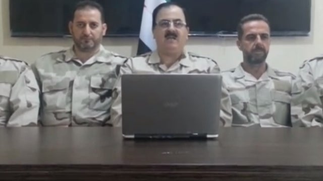 Gen. Salim Idriss, head of the opposition Syrian National Coalition's Supreme Military Council, flanked by two of his subcommanders 
