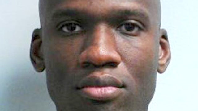 Family and friends wait to greet staff of the Naval Sea Systems Command headquarters as they are bused from the Washington Navy Yard to Nationals Park in Washington Sept. 16, 2013. 