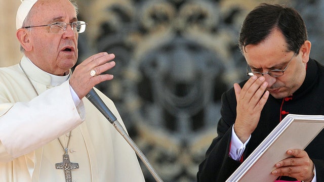 Pope Francis blesses the crowd during his general audience in St Peter's Square at the Vatican Sept. 18, 2013. 