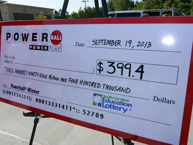 A giant check is displayed announcing a winner in the Powerball jackpot outside the Murphy Express store Sept. 19, 2013, in Lexington, S.C. 