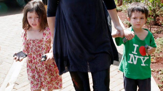 A woman with her two children rescued from the mall outside the Westgate Mall 