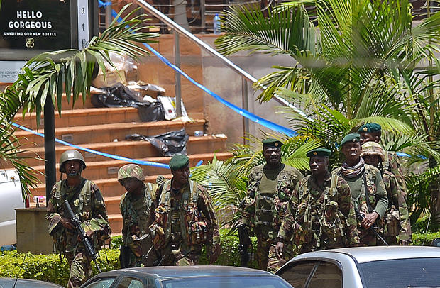 Kenyan soldiers walk outside the Westgate Mall 