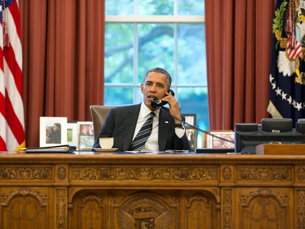 President Obama talks with President Hassan Rouhani of Iran during a phone call in the Oval Office at the White House in Washington Sept. 27, 2013. 
