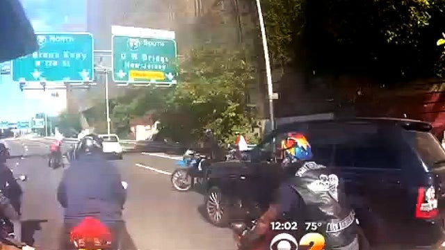 SUV is seen in video on Henry Hudson Parkway in Manhattan on Sept. 29, 2013; bikers confronted SUV's driver several times on the tape, and police say driver was then assaulted after tape ended 