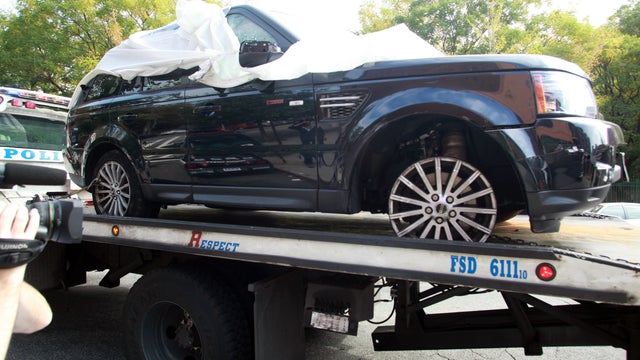 The Range Rover driven by Alexian Lien when he became involved in a confrontation in New York with several motorcyclists is moved to a police precinct, Saturday, Oct. 5, 2013.  