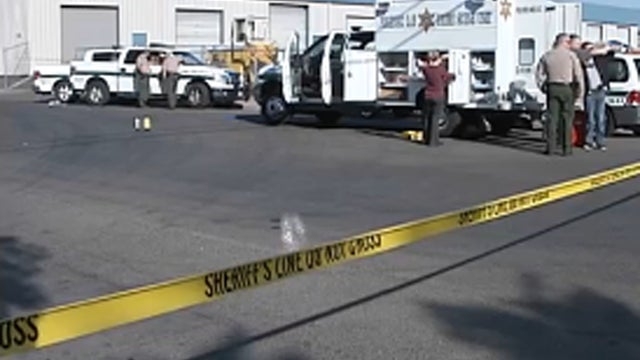 Investigators outside Soul Brothers motorcycle club early on Sept. 5, 2013 after gun battle left one person dead and a dozen wounded 