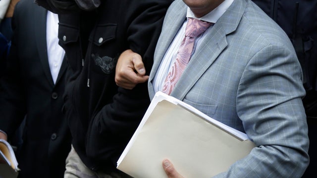 The Range Rover driven by Alexian Lien when he became involved in a confrontation in New York with several motorcyclists is moved to a police precinct, Saturday, Oct. 5, 2013.  
