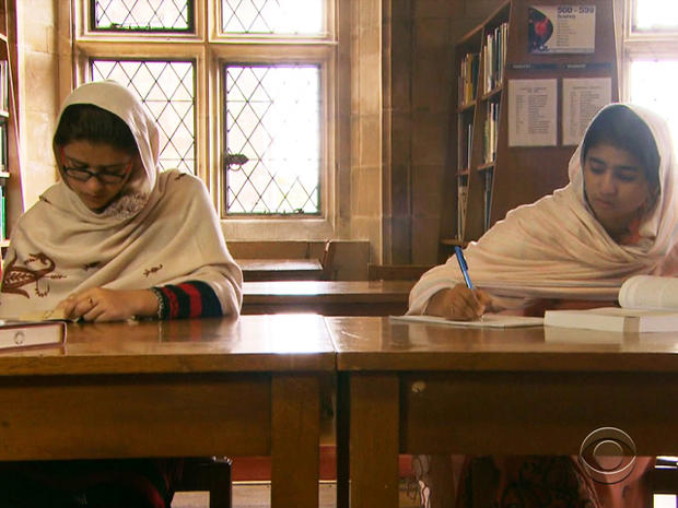 Kainat Riaz and Shazia Ramzan study in the library at Atlantic College. 