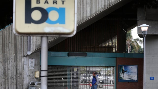 Man looks into shuttered Bay Area Rapid Transit (BART) West Oakland station on October 21, 2013; 4-day walkout ended that night when tentative accord with unions was reached 
