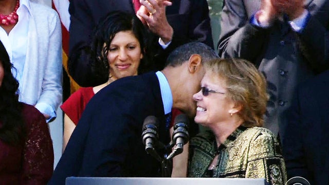 Janice Baker, shown with President Barack Obama on Monday, has been hailed as the first person in Delaware to sign up for health insurance under Obamacare. 