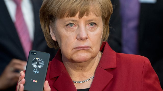 German Chancellor Angela Merkel presenting a tap-proof smartphone 