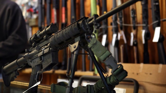 An AR-15-style rifle sits on the counter at Freddie Bear Sports sporting goods store Dec. 17, 2012, in Tinley Park, Ill. 