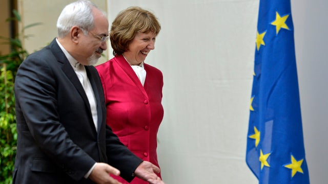 EU High Representative for Foreign Affairs Catherine Ashton, right, walks next to Iranian Foreign Minister Mohammed Javad Zarif 