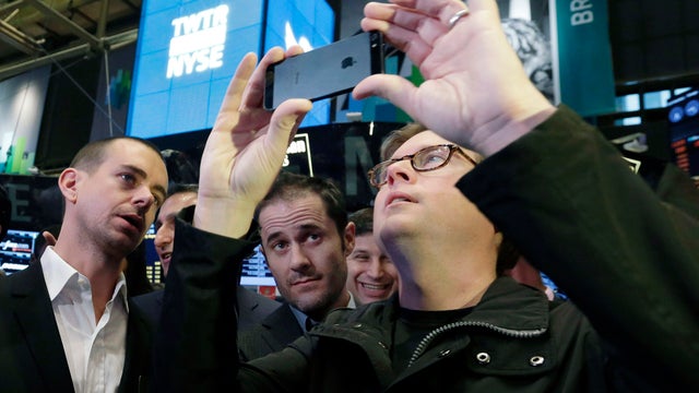 Twitter chairman and co-founder Jack Dorsey and co-founders Evan Williams and Biz Stone wait for the opening bell at the New York Stock Exchange Nov. 7, 2013. 