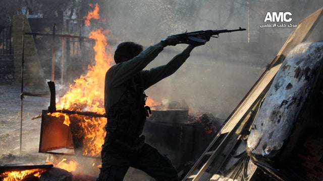 Free Syrian Army fighter fires gun at Syrian army  in Aleppo 