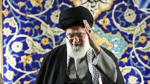 Iran's Supreme Leader Ayatollah Ali Khamenei waves to members of the paramilitary Basij force at the Imam Khomeini Grand Mosque in Tehran 