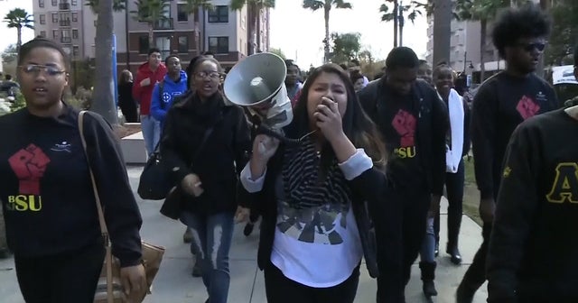 Students charged with hate crime after racial harassment - CBS News