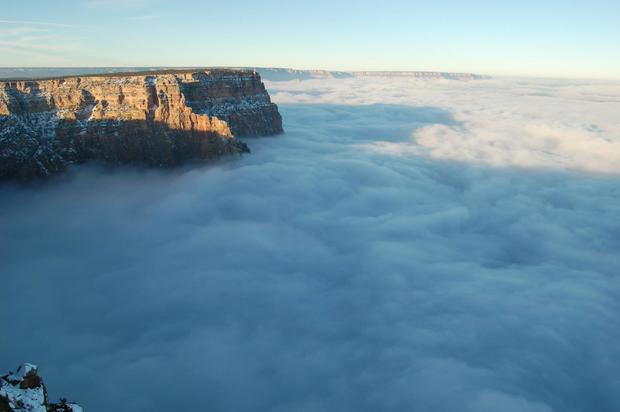 ​A view of the Grand Canyon filled with fog due to a temperature inversion. 