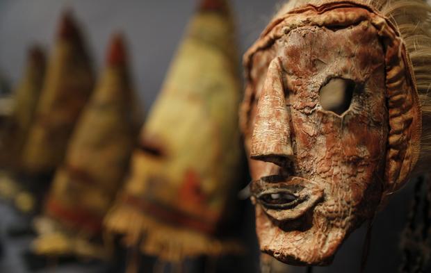 A rare antique tribal mask, Kachina Hapota, circa 1910-1920, revered as a sacred ritual artifact by the Native American Hopi tribe in Arizona is displayed at the Drouot auction house in Paris before auction, December 9, 2013. The Hopi, some of whose 18,000 members continue to follow a traditional way of life farming on three isolated mesas, believe the bright, mostly fabric masks are imbued with the spirits of divine messengers. 