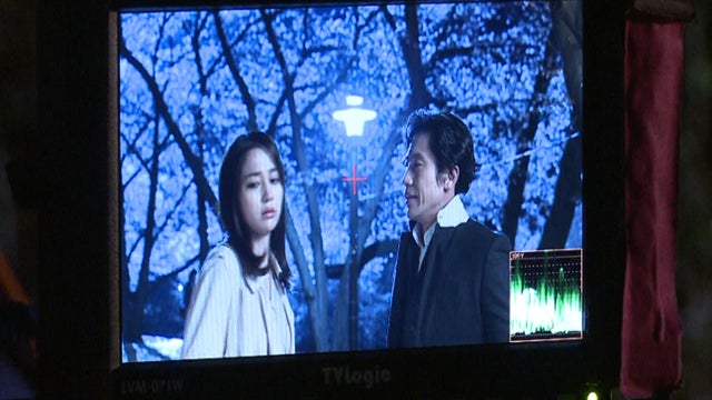Actors are seen on a production monitor during the filming of a television drama in South Korea 