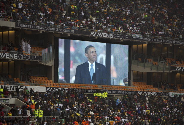 President Obama speaks to mourners attending the memorial service for former South African president Nelson Mandela at the FNB Stadium in Soweto near Johannesburg 
